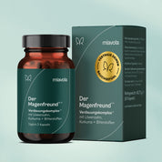 Der Magenfreund von miavola: Braunglasdose mit 60 Kapseln neben der Faltschachtel, Aufdruck „Verdauungskomplex mit Löwenzahn, Kurkuma und Bitterstoffen"